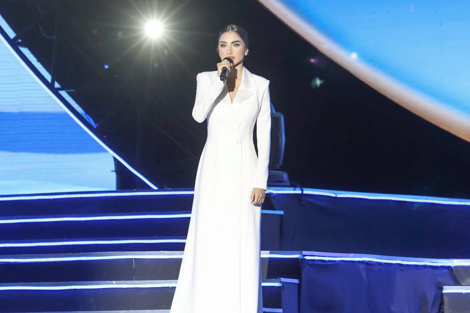 Maggie Tabibi hosting on stage